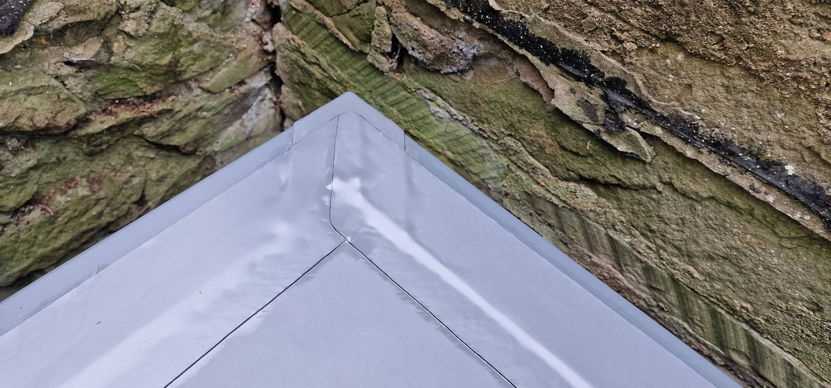 Corner detail on a garage single ply flat roof